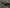 Close-up of a motorcycle handlebar with control buttons on a blurred background