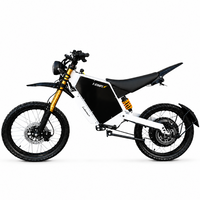 A white and black SB Thnder electric dirt bike with gold suspension forks and an orange rear shock, shown from a side profile on a white background.